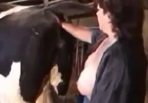 Redhead mom shoves her palm in the horse ass